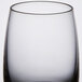 A close up of a clear Spiegelau Vino Grande shot glass with a black rim.