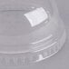 A clear plastic dome lid with a hole on top over a clear plastic container.