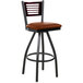 A BFM Seating black metal bar stool with a mahogany wood back and light brown vinyl seat.