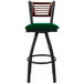 A BFM Seating bar stool with a green swivel seat and black metal frame.