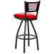 A black metal BFM Seating bar stool with red vinyl seat and mahogany wooden back.