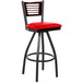A BFM Seating black metal bar stool with a mahogany back and red vinyl seat.