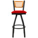 A BFM Seating black metal bar stool with a red cushion and wooden back.