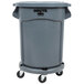 A Rubbermaid BRUTE gray trash can, lid, and dolly kit.