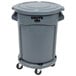 A Rubbermaid grey garbage can with a lid and wheels.
