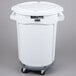 A white Rubbermaid BRUTE trash can with wheels and a lid.
