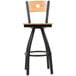 A BFM Seating black metal bar stool with a natural wooden back and swivel seat.