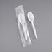 Two Choice white plastic spoons in plastic packaging.