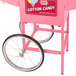 A pink Carnival King cotton candy cart wheel frame.