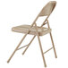 A National Public Seating beige metal folding chair.