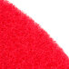 A close up of a red Scrubble buffing pad.