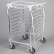 A clear plastic covered rack on a metal cart.
