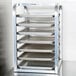 A Channel countertop sheet pan rack with trays on it.