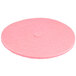 A pink round Scrubble by ACS burnishing floor pad.