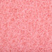 A close-up of a pink Scrubble burnishing pad.