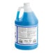 A blue jug of Noble Chemical Dry It Concentrated Low Rinse Aid with a white label.