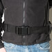 A person wearing a black Unger ErgoTec padded belt with a buckle.