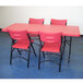 National Public Seating 640 Black Metal Folding Chair with Red Blow Molded Plastic Back and Seat Main Thumbnail 4