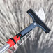 A red Unger ErgoTec locking cone on a window cleaning tool.