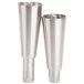 A set of six silver Master-Bilt refrigerator equipment legs with nuts on them.