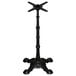 A black FLAT Tech cast iron bar height table base with a star-shaped stand.