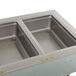 A Delfield drop-in hot food well with three compartments on a counter.
