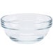 An Arcoroc clear glass ingredient bowl with a handle.