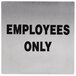 A stainless steel sign with black letters that says "Employees Only"