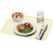 A Cambro rectangular key lime tray with food including meat and potatoes, a bowl of tomato and cheese salad, and a glass of water on it.