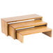 A Tablecraft acacia wood display riser set with three different sizes.