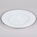 A set of 12 white alabaster glass charger plates with a silver rim.