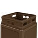 A brown plastic Commercial Zone waste container with a dome lid.