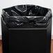 A black Commercial Zone PolyTec hexagonal waste container with an open top with a black bag inside.