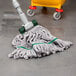 A Unger SmartColor Microfiber Mop Kit with a white plastic handle.