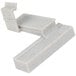 A white plastic Cambro Camshelving connector with black specks.
