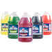 Four jugs of Carnival King cotton candy snow cone syrup in different colors.