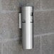 A stainless steel Aarco wall mounted cigarette and ash receptacle.