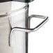 A Grindmaster stainless steel iced tea dispenser on a counter.