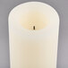 A white Sterno programmable flameless wax pillar candle.