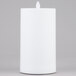 A white rectangular Sterno Mirage flameless LED candle on a gray surface.