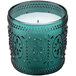 A green glass Sterno Amelia flameless candle holder with a decorative design.