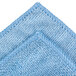 A close up of a blue Unger SmartColor microfiber cleaning cloth.
