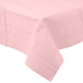 A Classic Pink Tissue / Poly Table Cover with a white border on a table.
