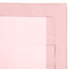 A Classic Pink Tissue / Poly Table Cover with a white border.