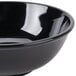 A close-up of a black shiny GET Elegance melamine bowl.