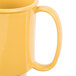 A case of 24 yellow Tritan plastic mugs with two handles.