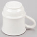 A close up of a white GET plastic mug with a handle.