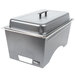 A Sterno full size silver metal chafer with lid on a counter.