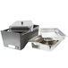 A Sterno silver vein metal tray with a lid and two pans on a counter.