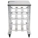 A silver metal Regency can rack cart with shelves on wheels.